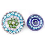 Two millefiori glass paperweights including a Caithness miniature thistle example, the largest 8cm