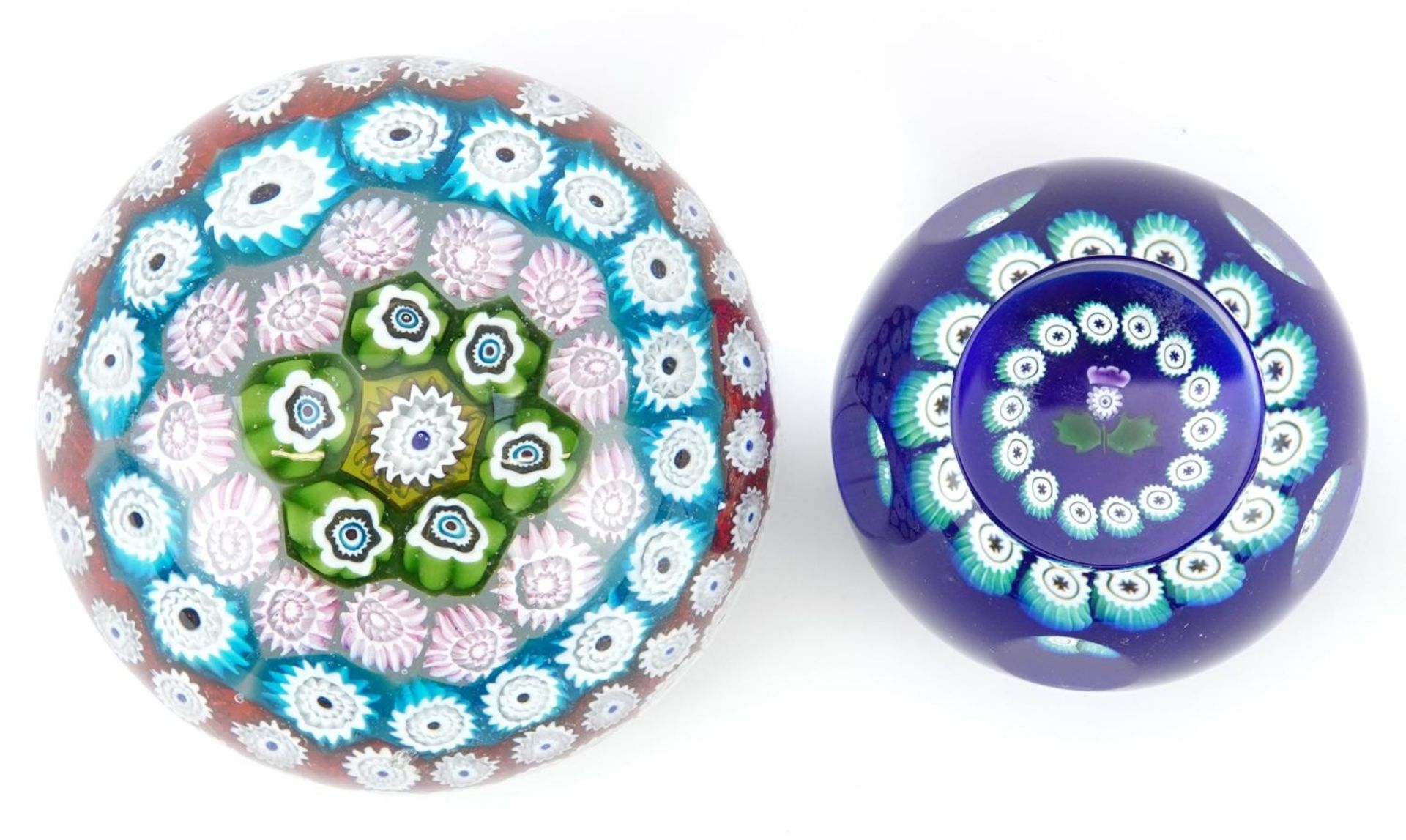 Two millefiori glass paperweights including a Caithness miniature thistle example, the largest 8cm