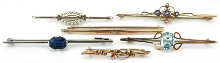 Six antique and later bar brooches, some 9ct gold, including a white metal Art Deco brooch set