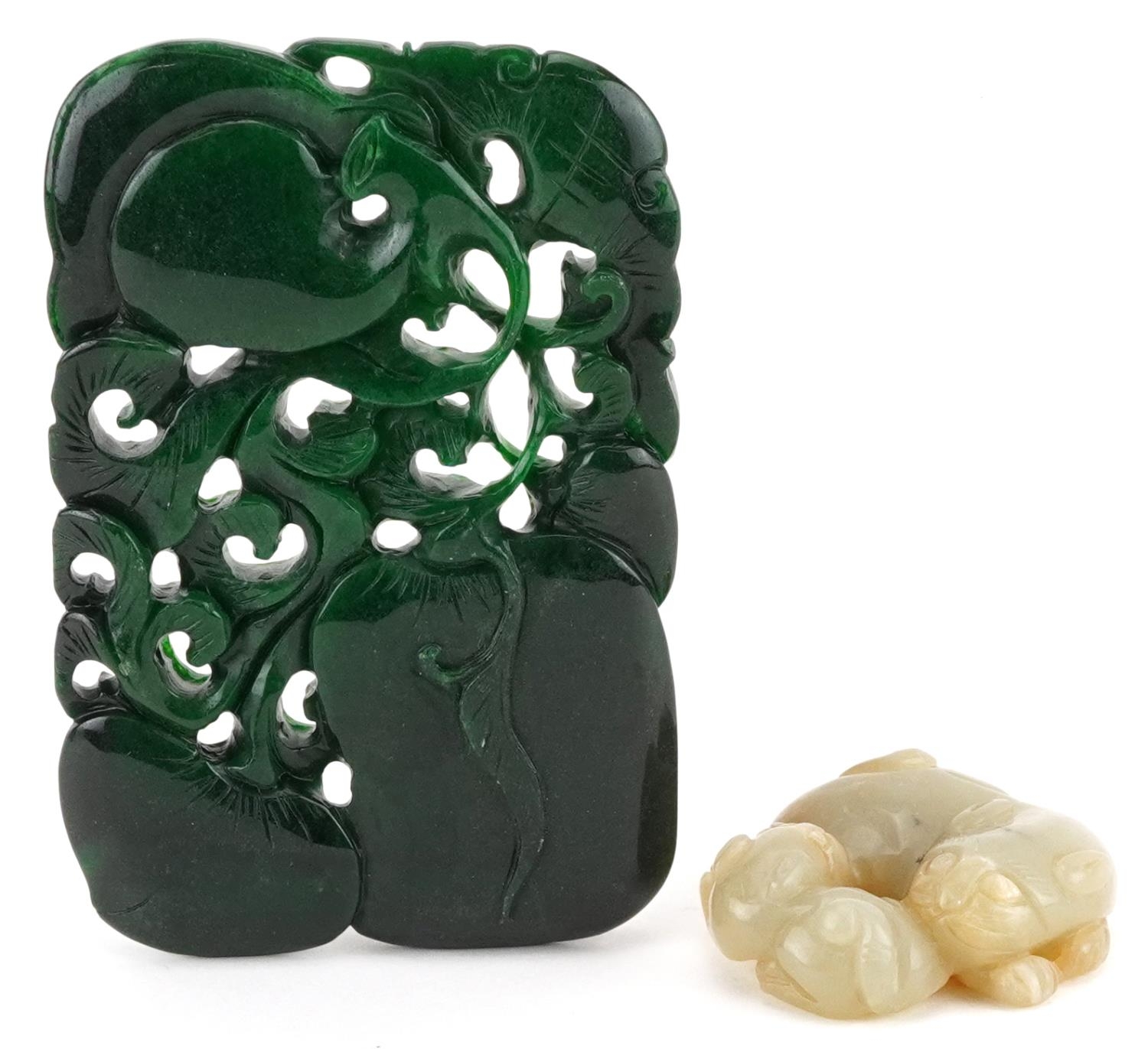 Two jade carvings including a green panel carved with fruit, the largest 11cm x 7.5cm