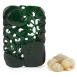 Two jade carvings including a green panel carved with fruit, the largest 11cm x 7.5cm