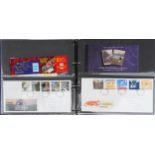 Collection of British mint stamps, booklets and first day covers arranged in three albums
