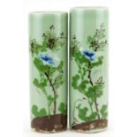 Matched pair of Japanese celadon glazed porcelain cylindrical vases hand painted with flowers,
