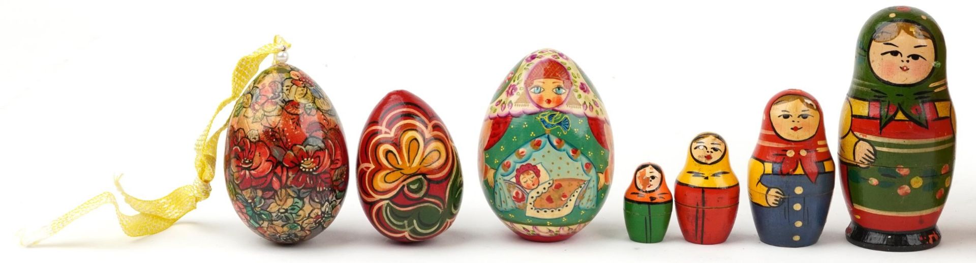 Three Russian Matryoshka stacking dolls and three lacquered eggs, the largest stacking doll hand - Image 2 of 3
