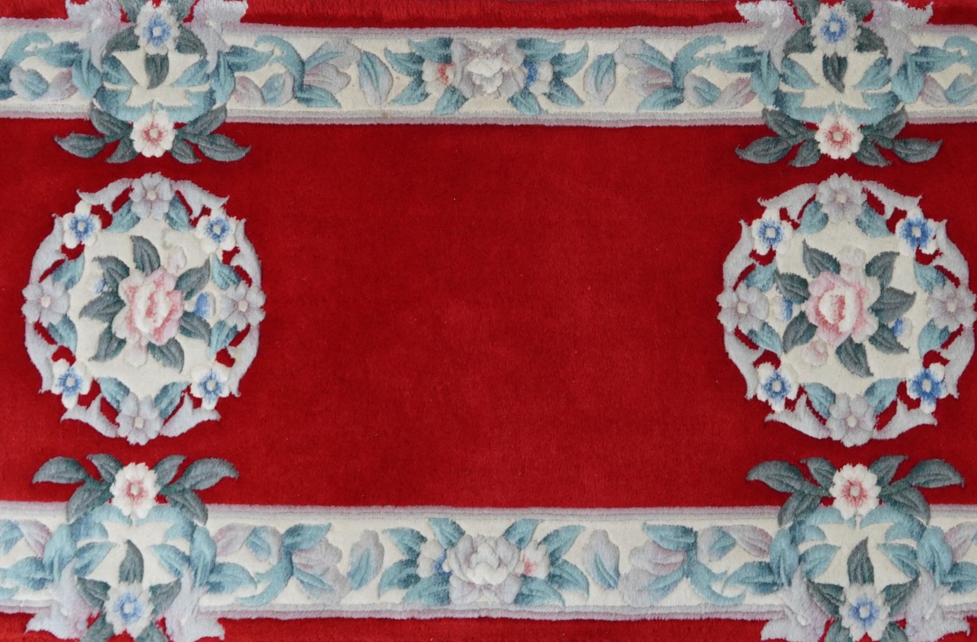 Three Chinese red ground floral rugs including a runner, the largest 255cm x 70cm - Image 12 of 13