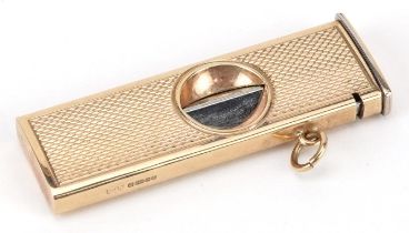 S J Rose & Son, engine turned 9ct gold cased cigar cutter, Birmingham 1985, 5.5cm in length, total