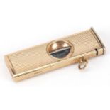 S J Rose & Son, engine turned 9ct gold cased cigar cutter, Birmingham 1985, 5.5cm in length, total