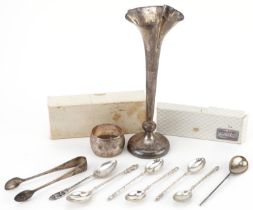 Silver objects comprising seven teaspoons, napkin ring, sugar tongs and bud vase, the largest 19.5cm