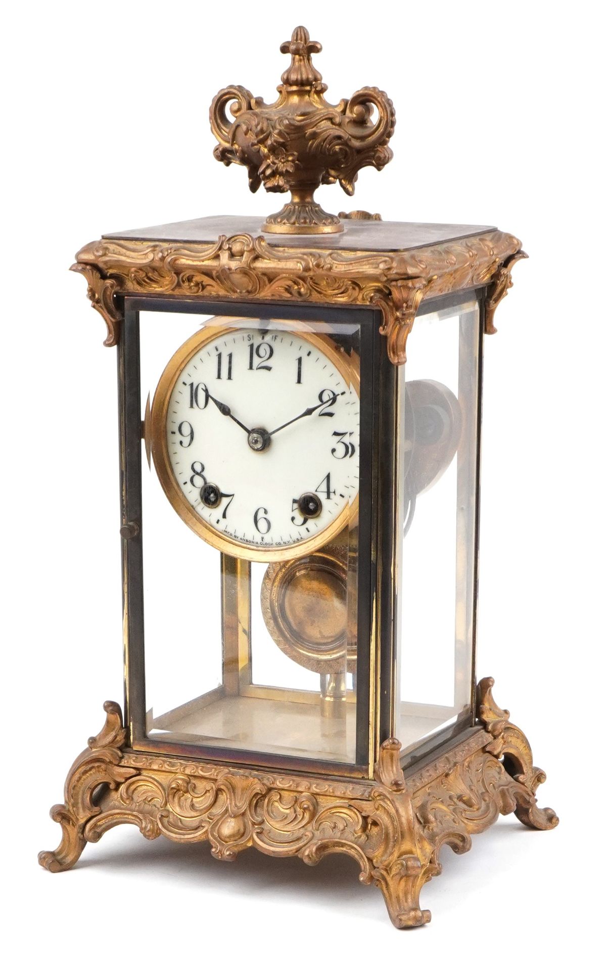 19th century ormolu four glass mantle clock striking on a gong with urn finial and circular