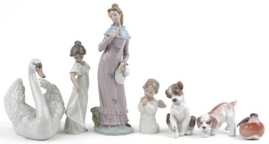 Seven collectable figures and animals including Royal Copenhagen robin, Lladro dogs and Lladro swan,