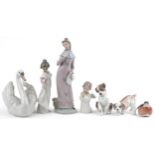 Seven collectable figures and animals including Royal Copenhagen robin, Lladro dogs and Lladro swan,