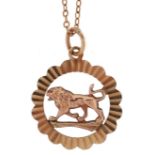 9ct gold Leo zodiac symbol pendant on a yellow metal necklace, 1.7cm in diameter and 46cm in length,