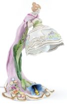 Plaue, German porcelain floral encrusted figural table lamp in the form of an Art Nouveau female,