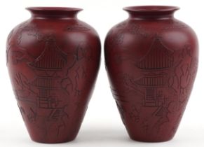 Pair of Chinese faux cinnabar lacquer porcelain vases incised with figures in a palace setting, each
