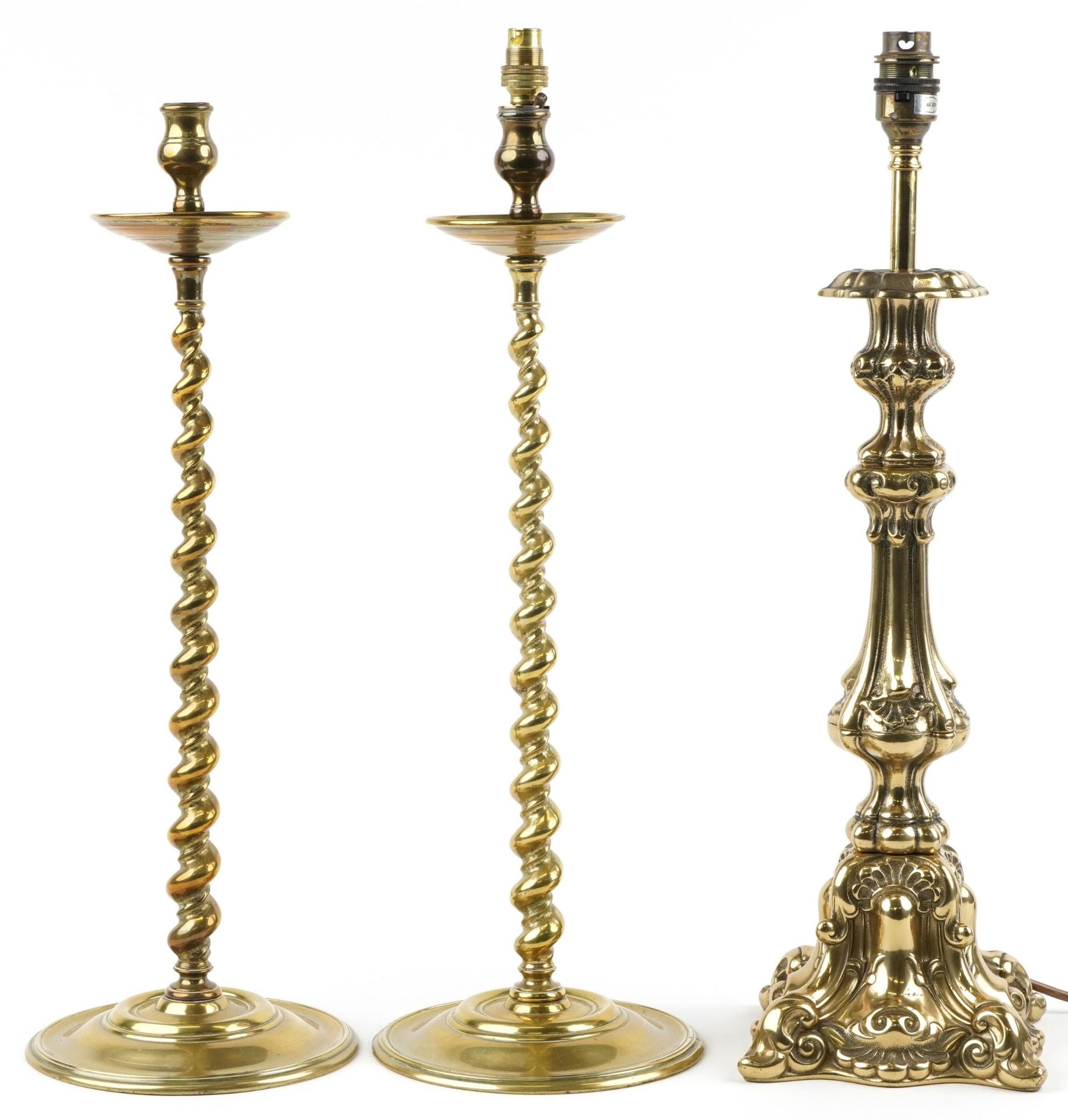 Pair of 19th century turned brass barley twist candlesticks and a classical brass table lamp, 51cm