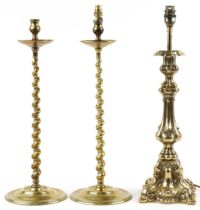 Pair of 19th century turned brass barley twist candlesticks and a classical brass table lamp, 51cm