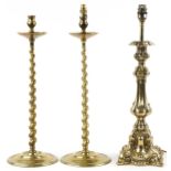 Pair of 19th century turned brass barley twist candlesticks and a classical brass table lamp, 51cm