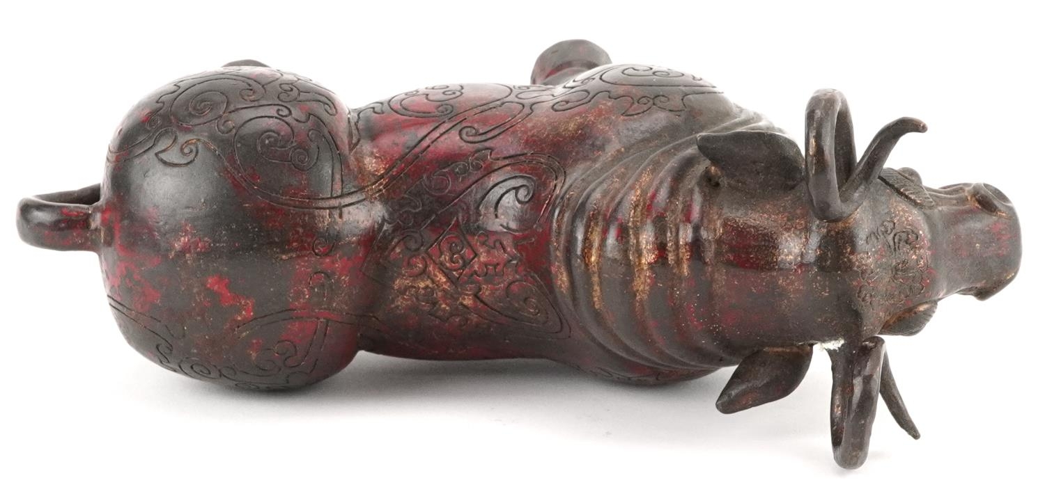 Chinese partially gilt and red lacquered bronze mythical animal, 22.5cm in length - Image 6 of 7