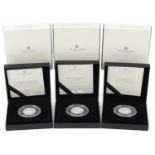 Three Elizabeth II 2022 silver proof fifty pence pieces by The Royal Mint, with fitted cases and