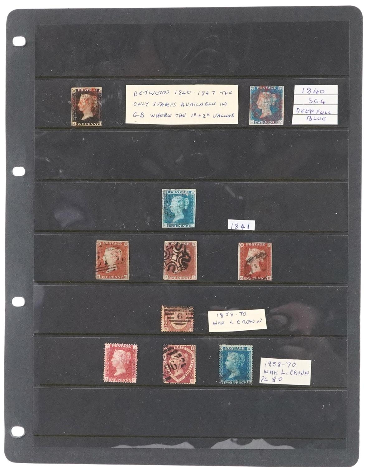 Victorian British stamps arranged on a sheet including Penny Black, Two Penny Blues and Penny Reds