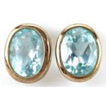 Pair of 9ct gold blue topaz stud earrings, each topaz approximately 8.0mm x 6.20mm x 4.40mm deep,