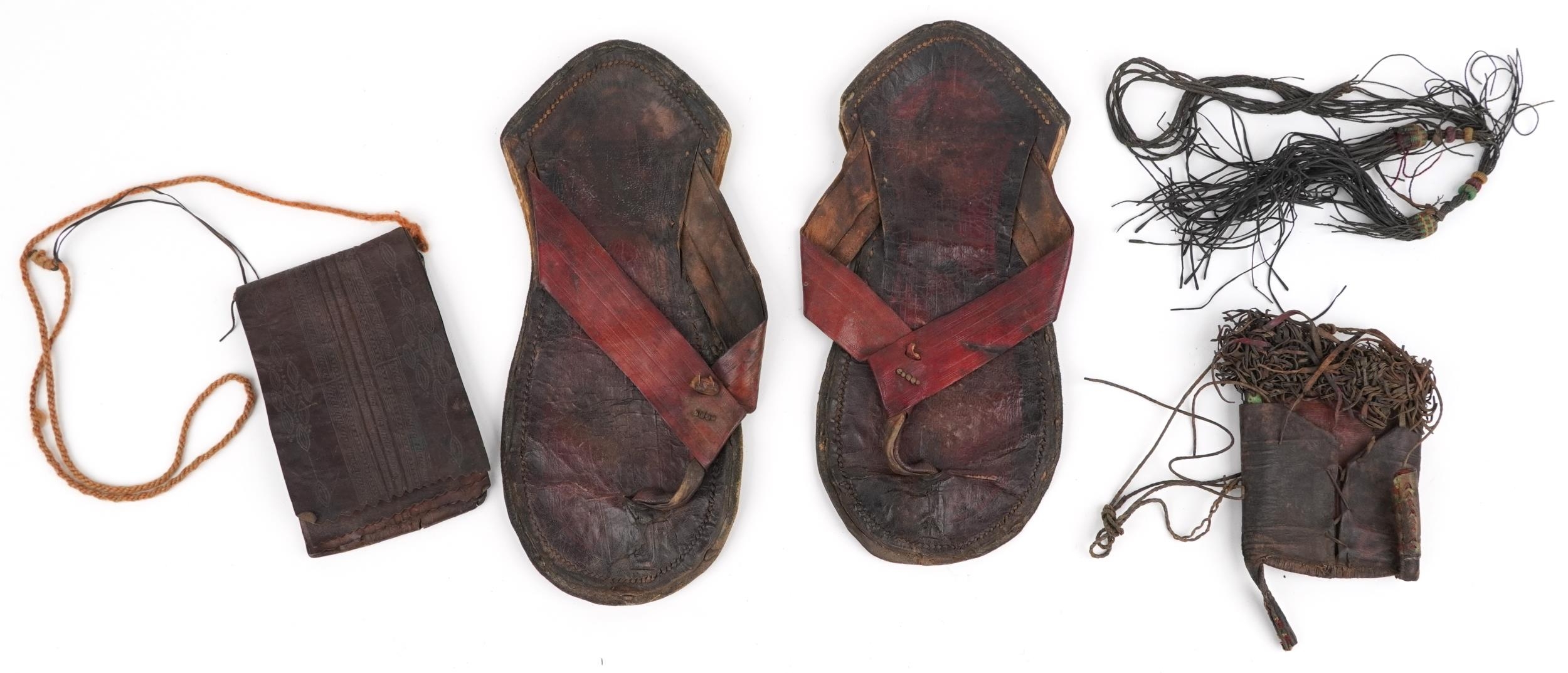 African tribal interest leather comprising pair of sandals and two pockets, each Tuareg tribe, the