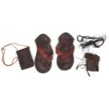 African tribal interest leather comprising pair of sandals and two pockets, each Tuareg tribe, the