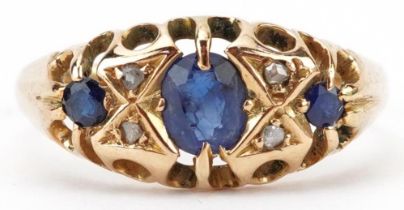Antique 18ct gold sapphire and diamond seven stone ring with pierced ornate setting, the largest