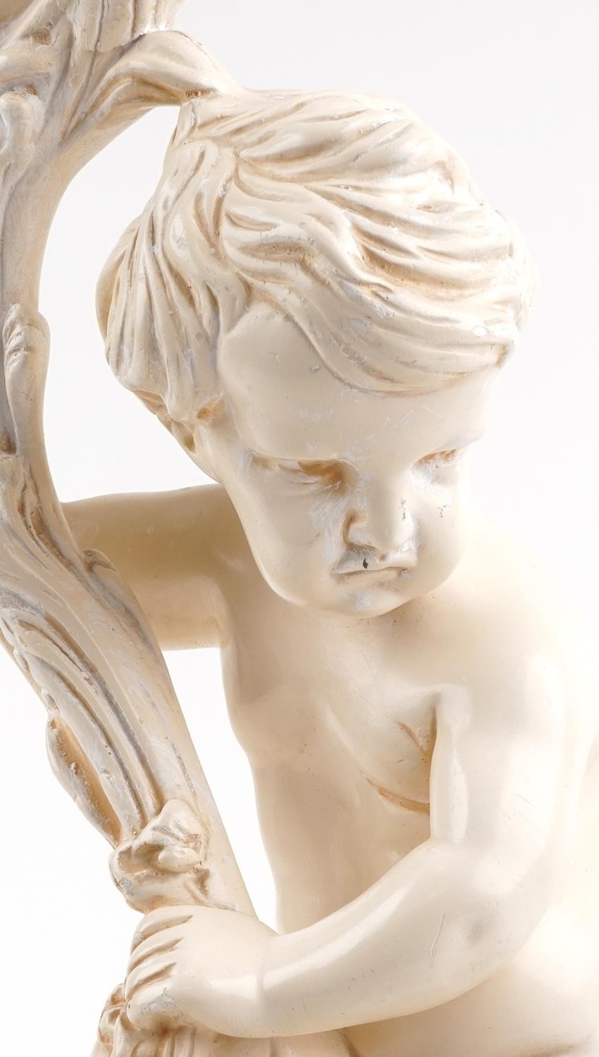 Classical plaster stand in the form of a nude Putti holding a cornucopia, 70cm high - Image 2 of 3