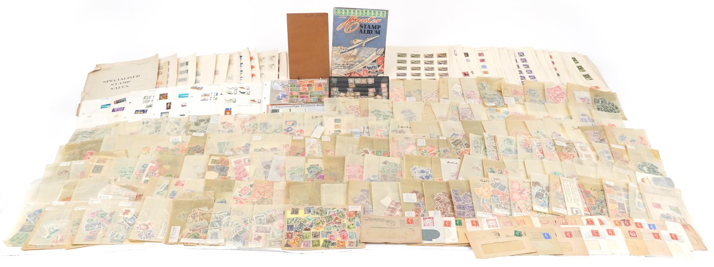 Extensive collection of British and world stamps, predominantly arranged on sheets, including China