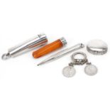 Edwardian and later silver objects including a butterscotch amber coloured cheroot holder with