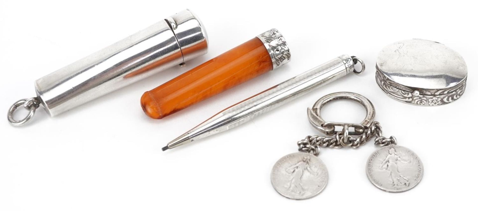 Edwardian and later silver objects including a butterscotch amber coloured cheroot holder with