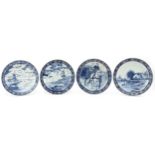 Boch, four Dutch Delft blue and white chargers including examples decorated after T Sonneville and