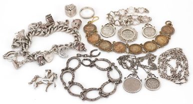 Silver jewellery including a charm bracelet with a collection of silver charms, lucky horseshoe