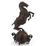Chinese partially gilt and red lacquered bronze of a rearing horse, 22.5cm high
