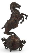 Chinese partially gilt and red lacquered bronze of a rearing horse, 22.5cm high