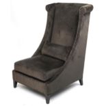 Contemporary dark olive green upholstered throne lounge chair with ebonised legs and cushion,