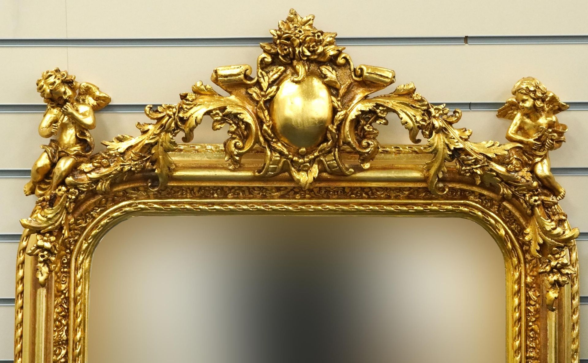 Large ornate gilt framed mirror having bevelled glass mounted with Putti musicians and swags, 62cm x - Bild 2 aus 3