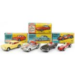 Four vintage Corgi Toys diecast vehicles with boxes comprising Aston Martin DB4 218, E Type Jaguar