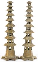 Pair of Chinese brass or bronze incense burners in the form of pagodas, 34cm high