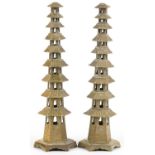 Pair of Chinese brass or bronze incense burners in the form of pagodas, 34cm high