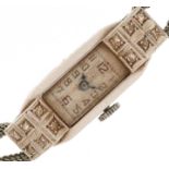 Art Deco platinum and diamond ladies manual wind cocktail watch on a white metal strap having Arabic