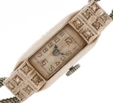 Art Deco platinum and diamond ladies manual wind cocktail watch on a white metal strap having Arabic