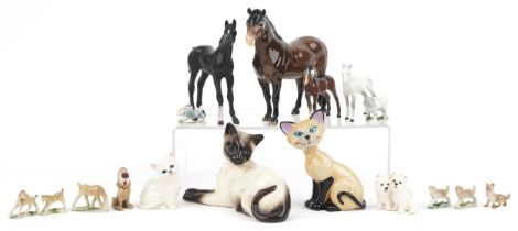 Collectable china including Beswick horses, Beswick Siamese cat and a Wade Disney blow up Siamese