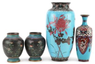 Four Japanese cloisonne vases including a pair enamelled with butterflies amongst flowers and an