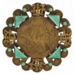 Chinese gilt metal green stone brooch embossed with a crane amongst foliage, 6cm in diameter, 18.2g