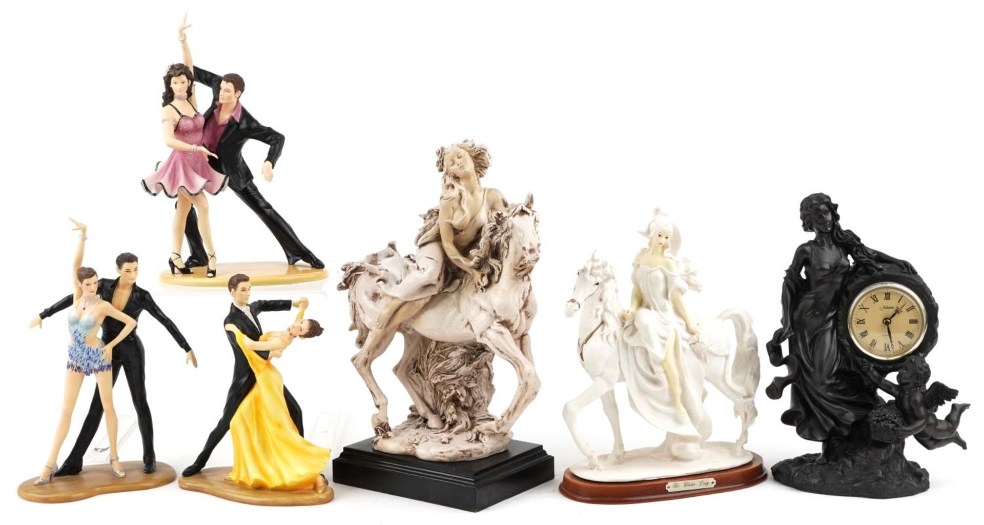 Decorative figures including a bronzed figural mantle clock, statue of a female on horseback