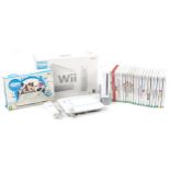 Nintendo Wii games console with accessories and a collection of games including U Drew, Wii Sports