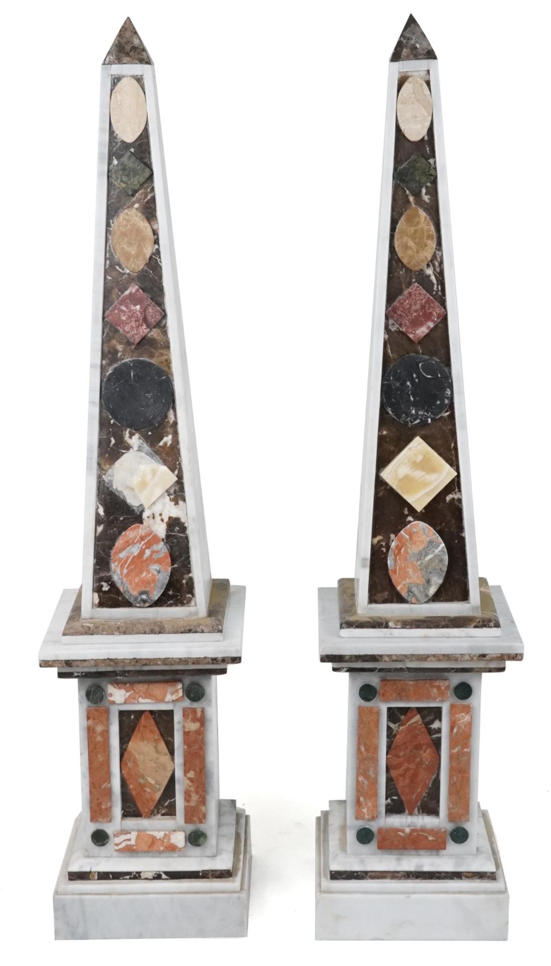 Pair of Grand Tour style floor standing white marble and hardstone obelisks on square stands, each