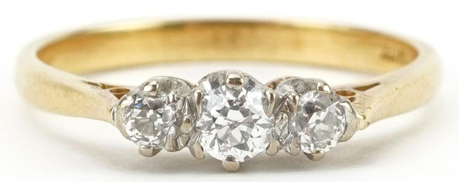 18ct gold diamond three stone ring, total diamond weight 0.20 carat, size P, 3.0g